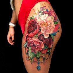 flowers tattoo by angry fox tattoo