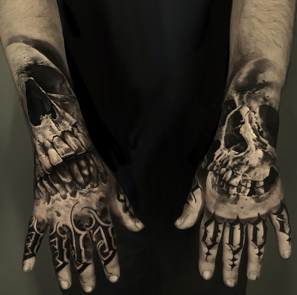 skulls on hands for men tattoo ideas