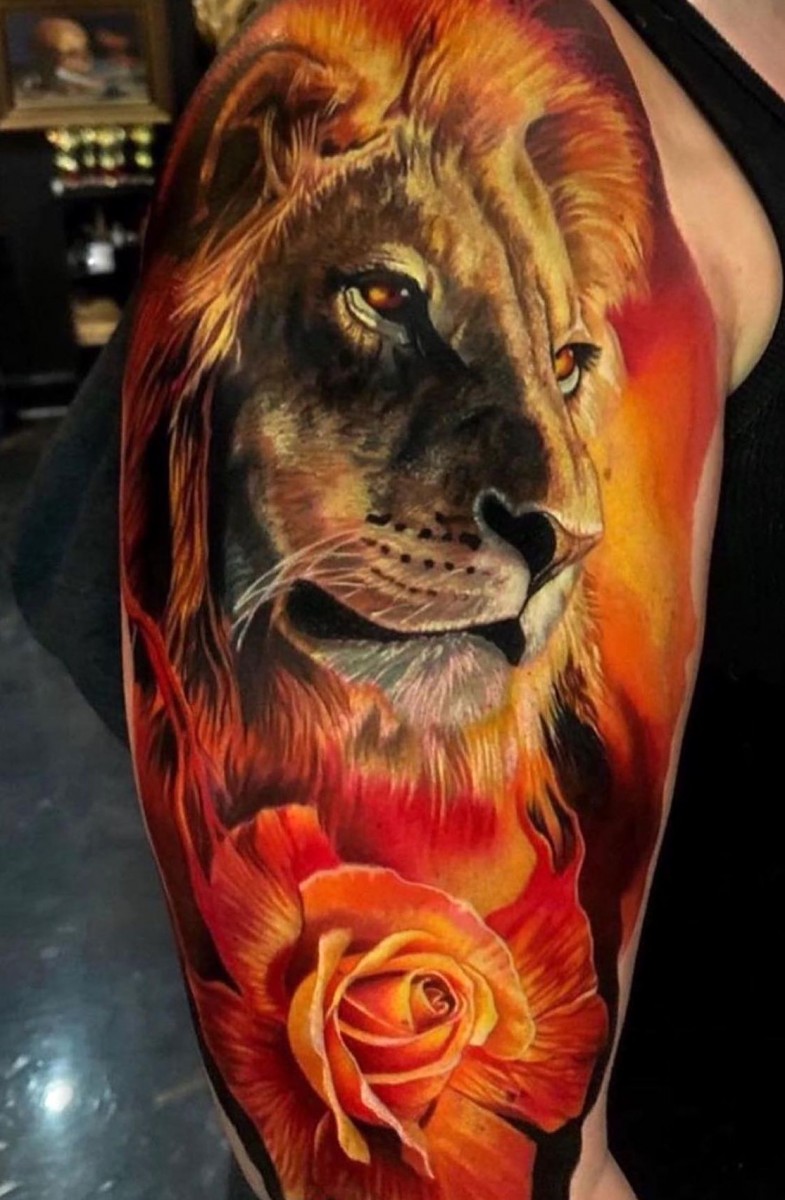 lion and rose tattoo on shoulder