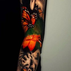 eagle tiger and flowewers tattoo on shoulder