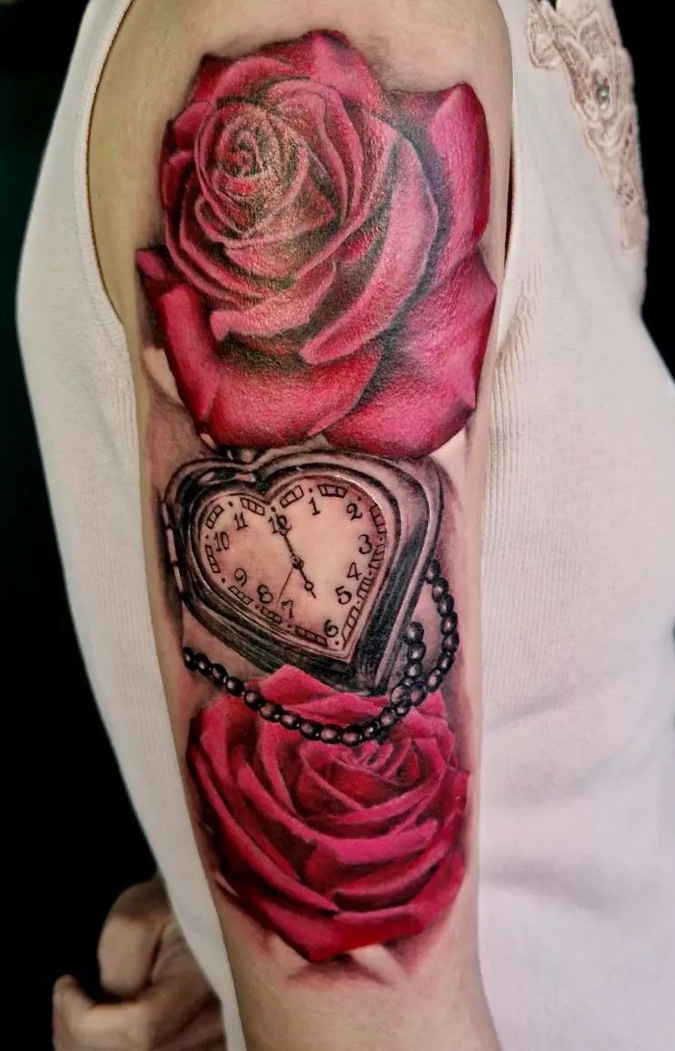 two red roses and clock shoulder tattoo