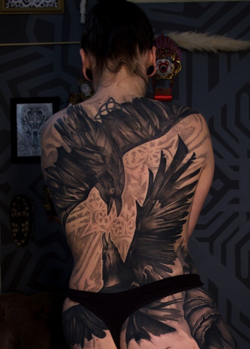two ravens tattooed on the back