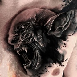 demon face on chest