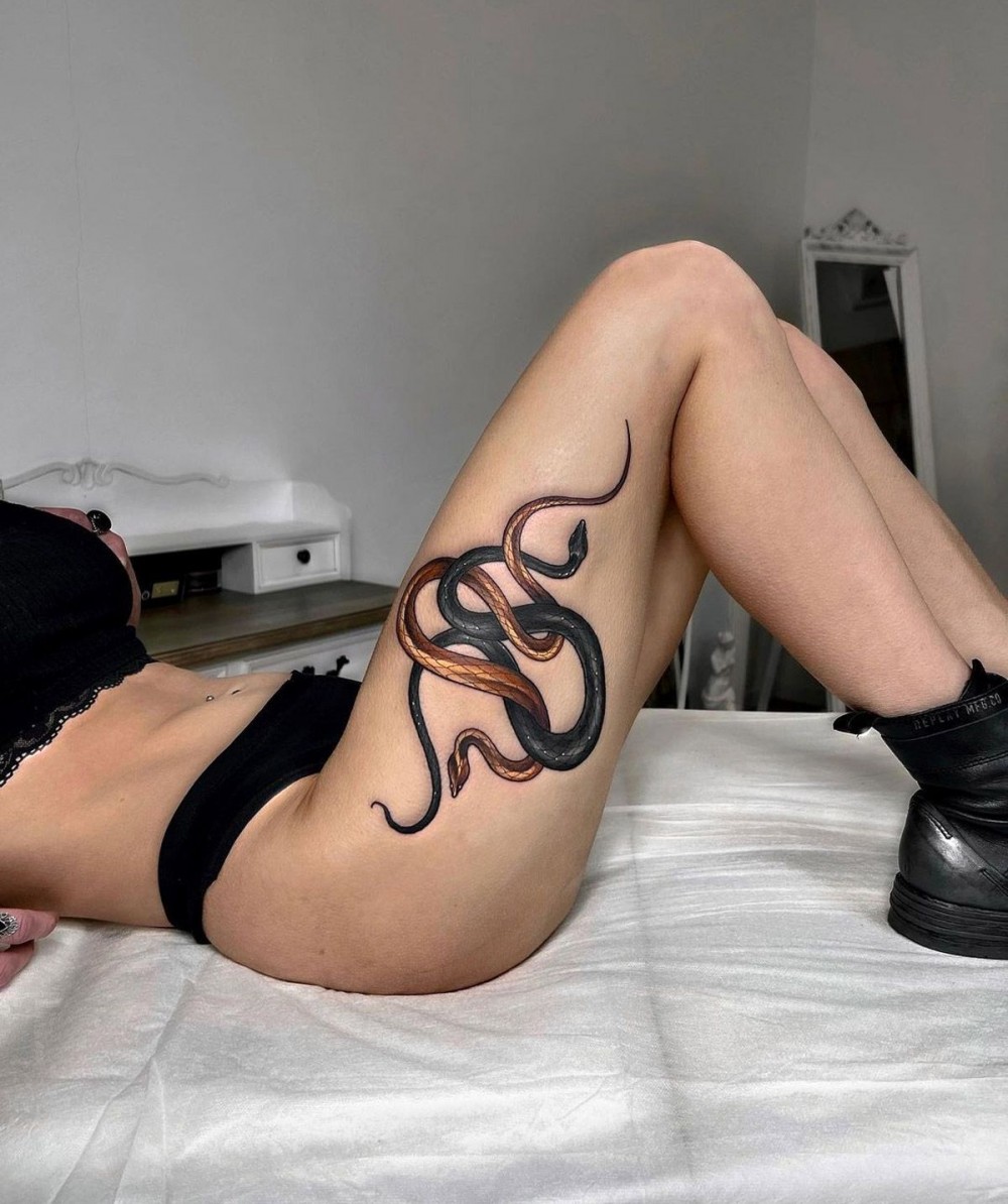 Snakes thigh tattoo,snake