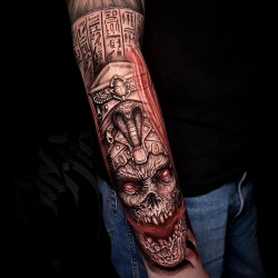 skull on hand aztec