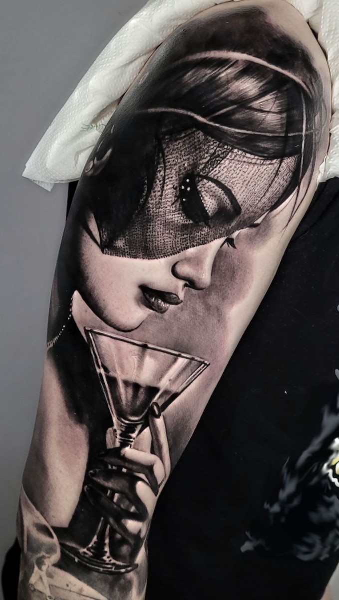 lady with drink tattoo on arm