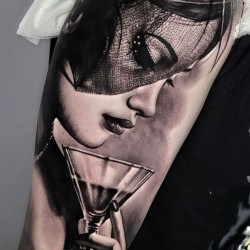 lady with drink tattoo on arm