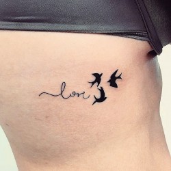 lowe swallows tattoo on ribs