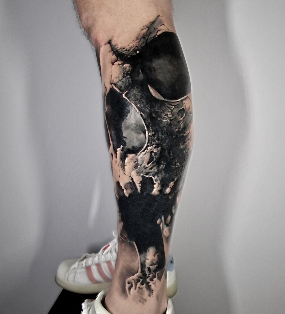 amazing skull on calf tattoo example