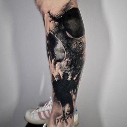 amazing skull on calf tattoo example