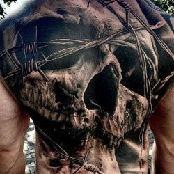 amazing and realistic skull on back tattoo