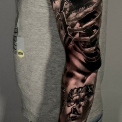 full arm tattoo with skulls