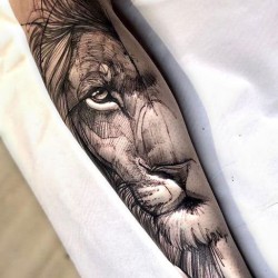 white lion tattooed on the calf