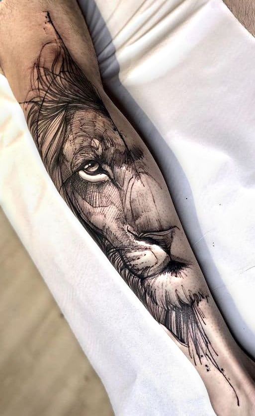 white lion tattooed on the calf