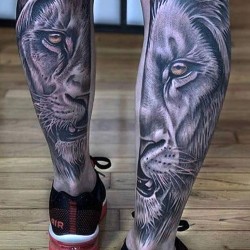 white lions tattooed on calves