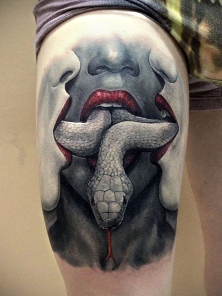 snake in mouth tattoos for women