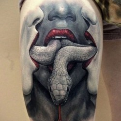 snake in mouth tattoos for women