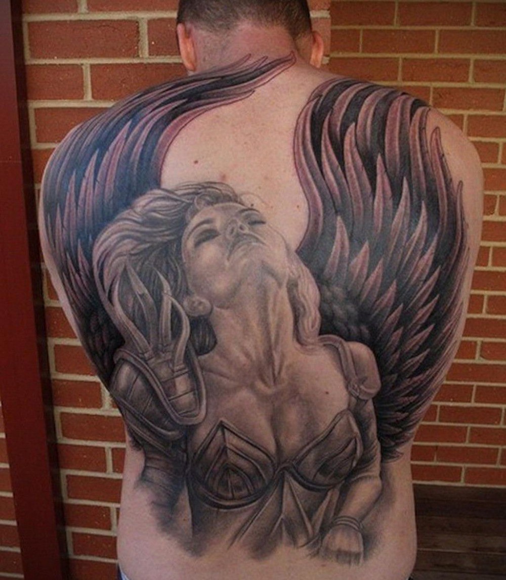 photo of a tattoo with an angel on the back