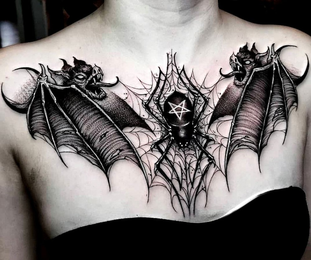 demons and spider on chest