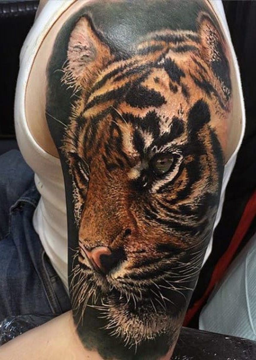 Photo realistic sleeve Tiger face tattoo