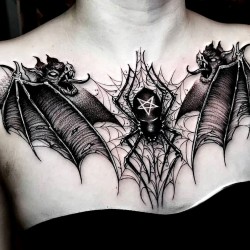 demons and spider on chest