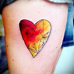 yellow and red heart tattoo