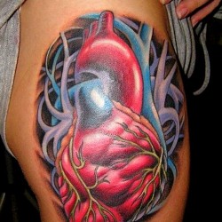 awesome new school heart tattoo on thigh