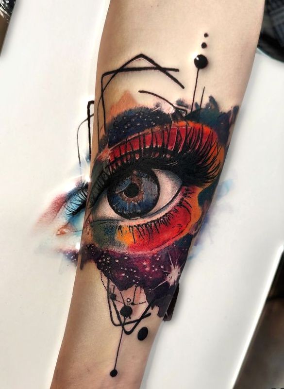 colorful eye tattoo on hand