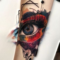 colorful eye tattoo on hand