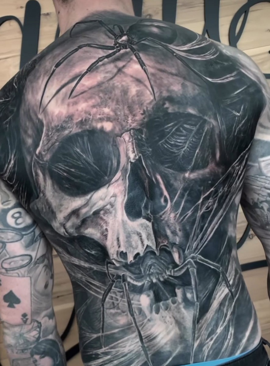 big skull and spider tattoo on back