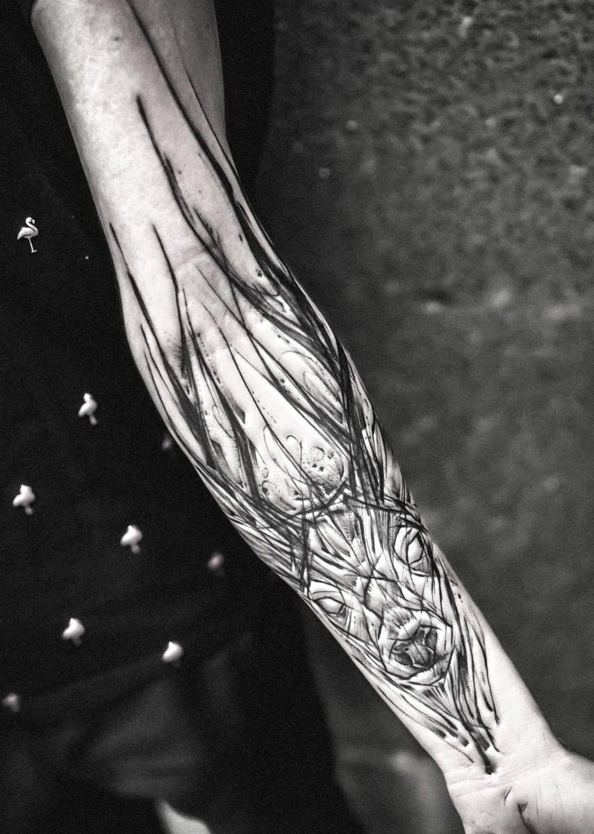 deer tattooed on the forearm