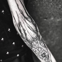 deer tattooed on the forearm