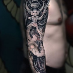 biomechanical,skull tattoo on shoulder